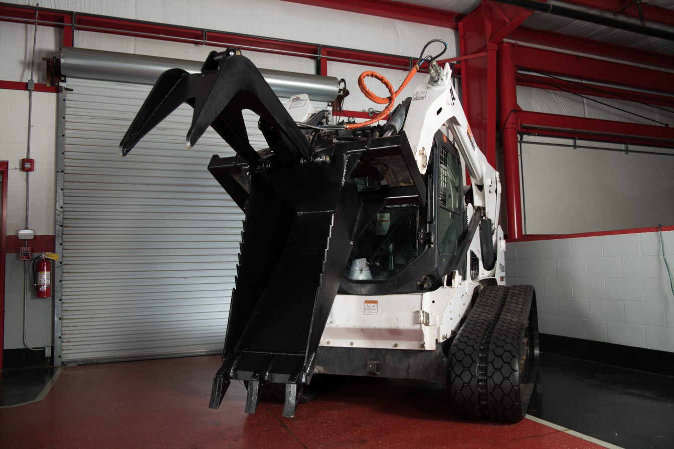 skid steer stump bucket on bobcat track loader